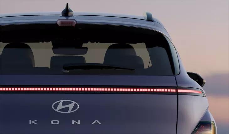 The rear end of a blue Hyundai Kona