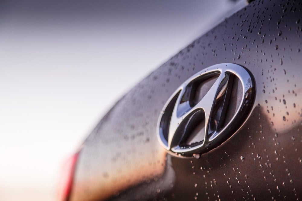 a close up of the hyundai logo on the hood of a car